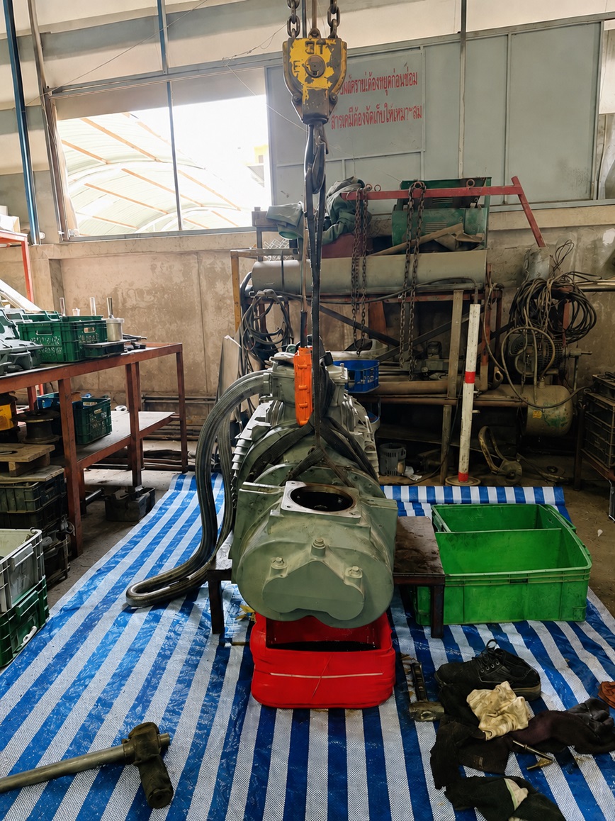 P.I.M service team performing air compressor maintenance